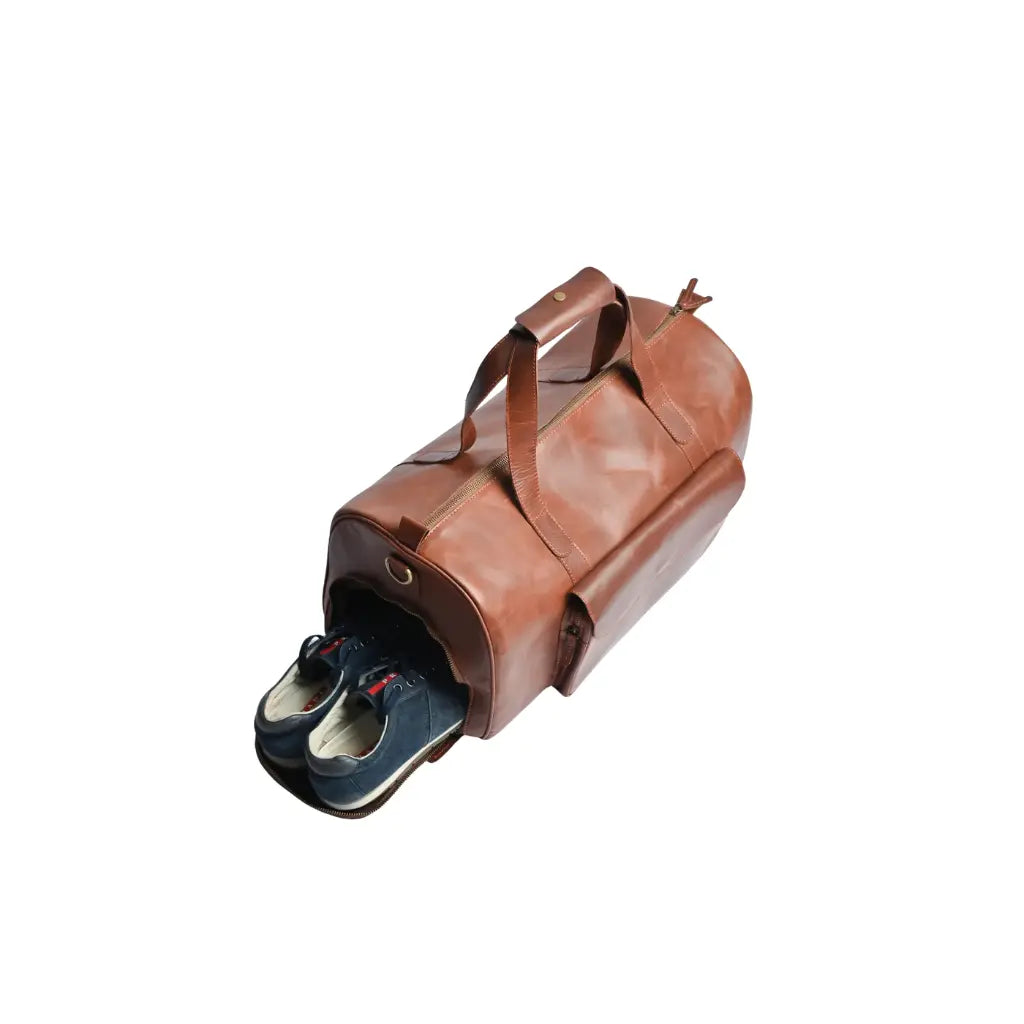 Camel Brown Premium Pull-Up Leather Duffle Bag with a dedicated zippered shoe compartment crafted from full-grain cowhide leather.