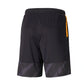 Back view of black soccer shorts with orange side accent