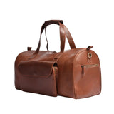 Angled front view of the Camel Brown Premium Pull-Up Leather Duffle Bag featuring a large front pocket and full-grain cowhide leather construction.