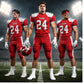 Custom American football uniforms worn by players on a football field