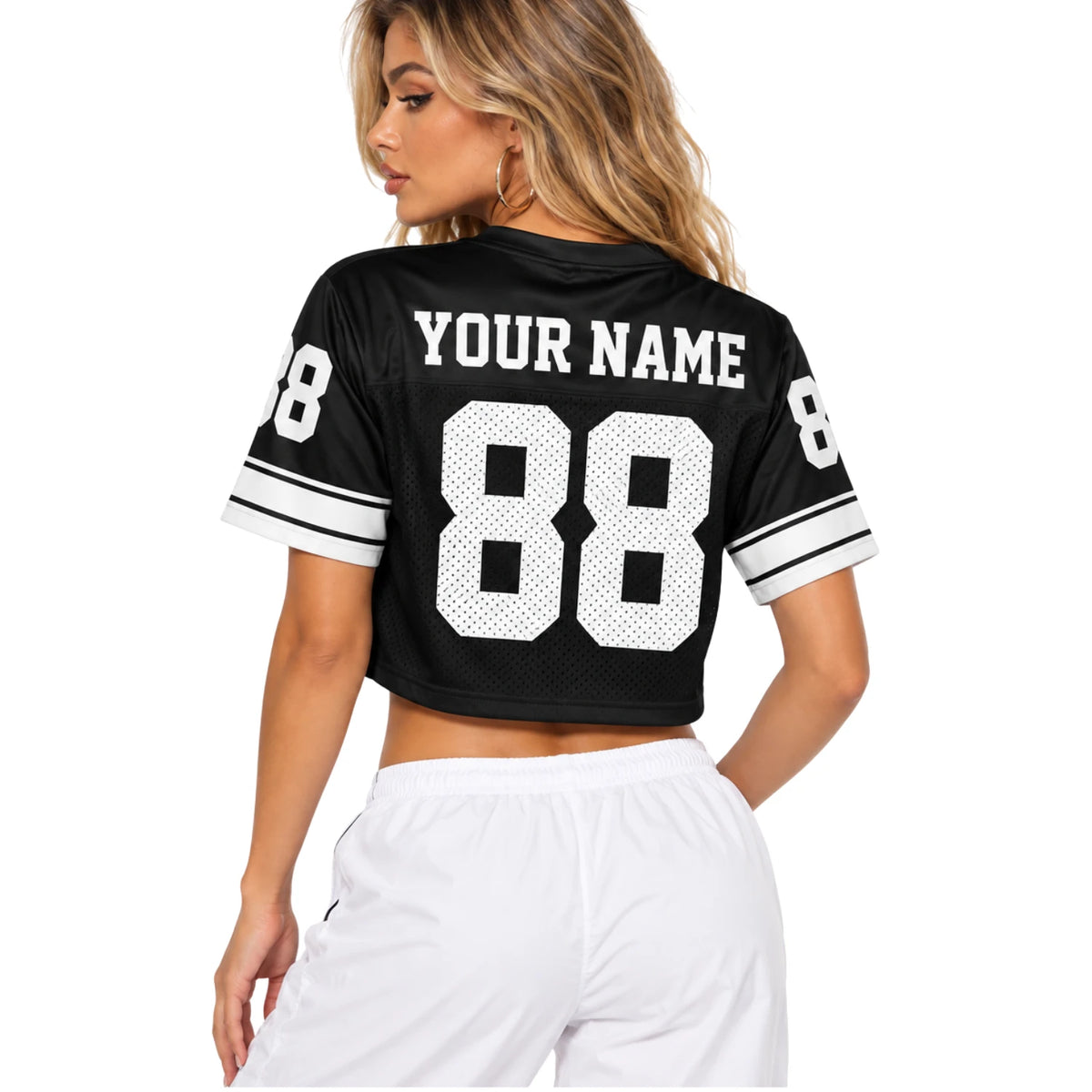 Back view of custom women's black and white crop football jersey with personalized name and number