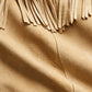 Close-up of brown western suede leather jacket showing fringe, texture and stitching