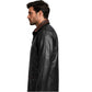 Side profile of men's hip length black leather winter car coat with brown trim worn by a male model.