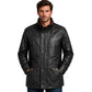 Three-quarter front view of men's hip length black leather winter car coat with brown trim on a male model.
