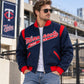 Men’s vintage blue wool letterman jacket worn by a male model