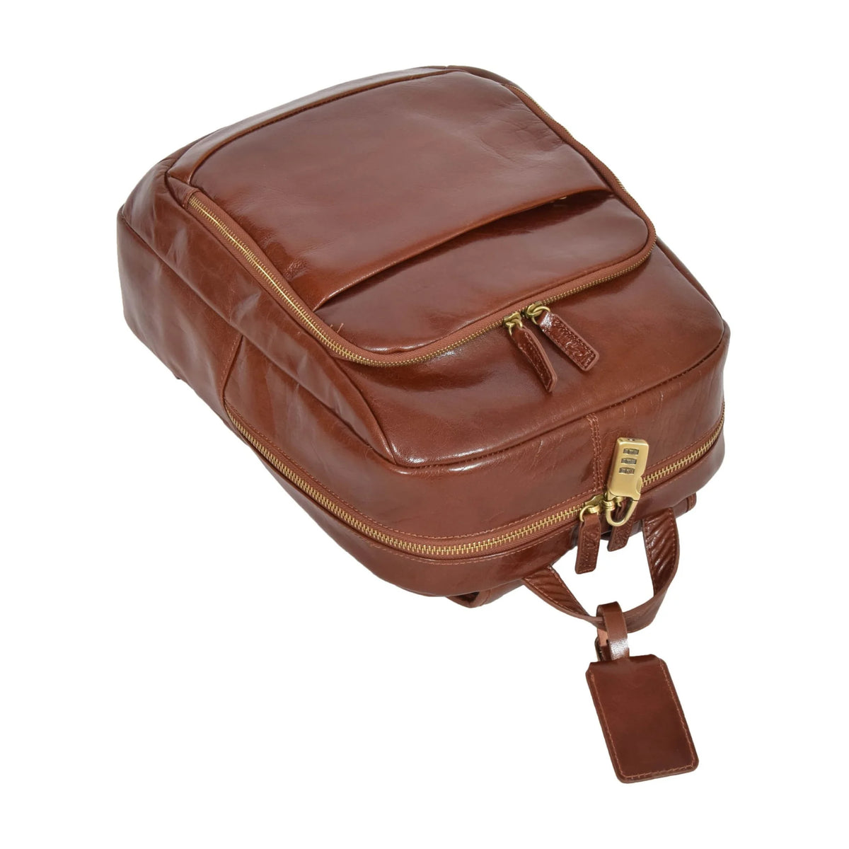 Angled top view of a tan leather travel backpack emphasizing the brass combination padlock, heavy-duty carry handle, and premium leather texture