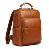The Pemberton genuine cognac brown cowhide leather backpack front view antique brass hardware laptop sleeve by Trico Gear
