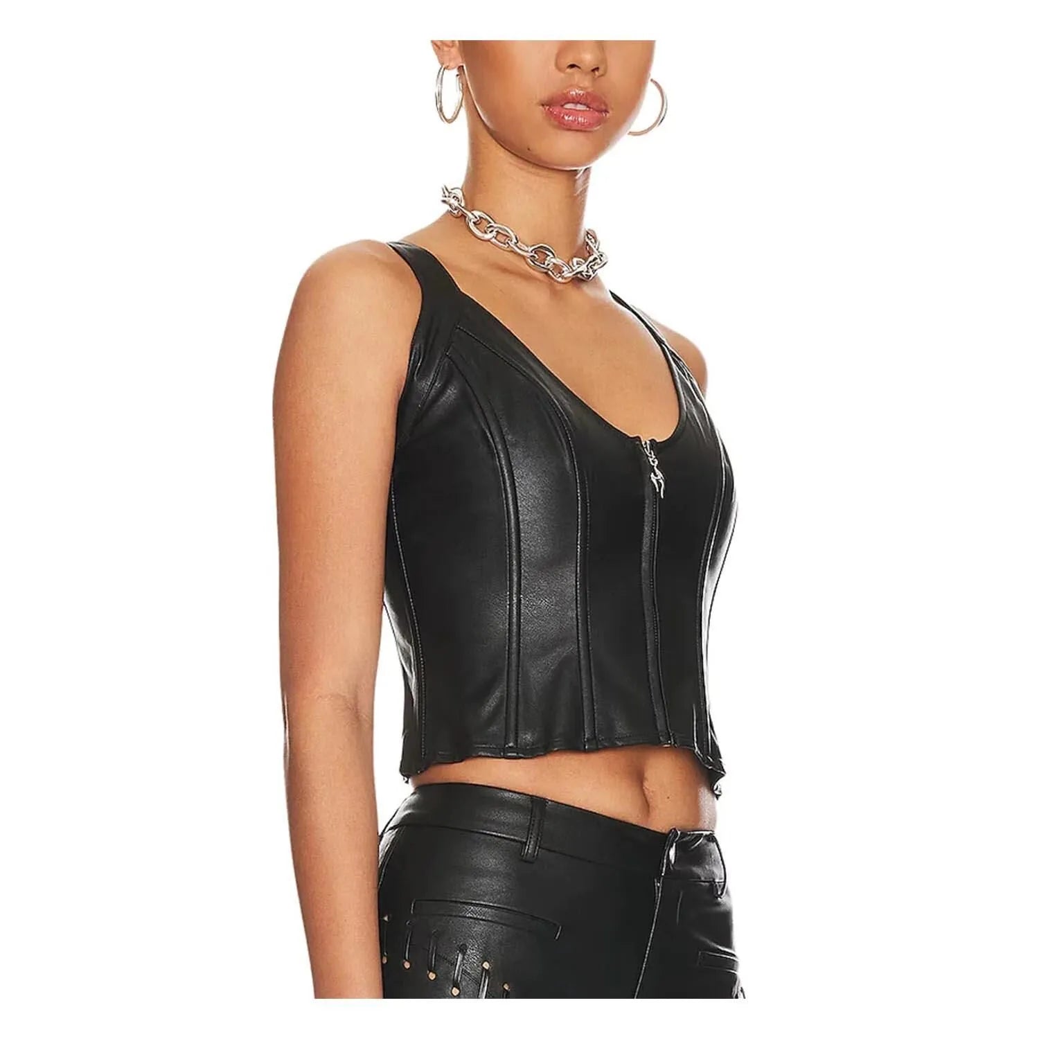 Three-quarter angled shot of a model wearing the structured black leather zip-up corset crop top, highlighting the seamless tailored fit and curved hemline