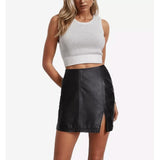 Front view of The Stella women's high-waisted black leather mini skirt highlighting the vertical panel seam design and distinct thigh-high front side slit