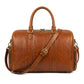 The Stratford genuine brown cowhide leather duffle bag side profile view adjustable shoulder strap end pockets by Trico Gear