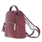 Three-quarter side view of The Verona Real Leather Small Burgundy Backpack displaying the smooth dual-zipper main track, polished gold-tone hardware accents, and protective bottom base studs