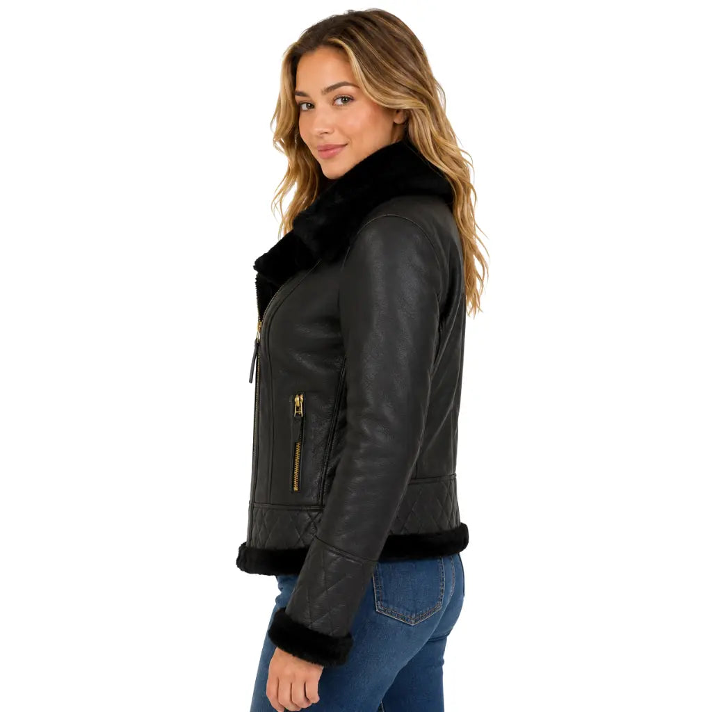 Side view of women's black B3 sheepskin leather jacket with detachable hood featuring quilted cuffs, soft shearling trim and premium leather finish.