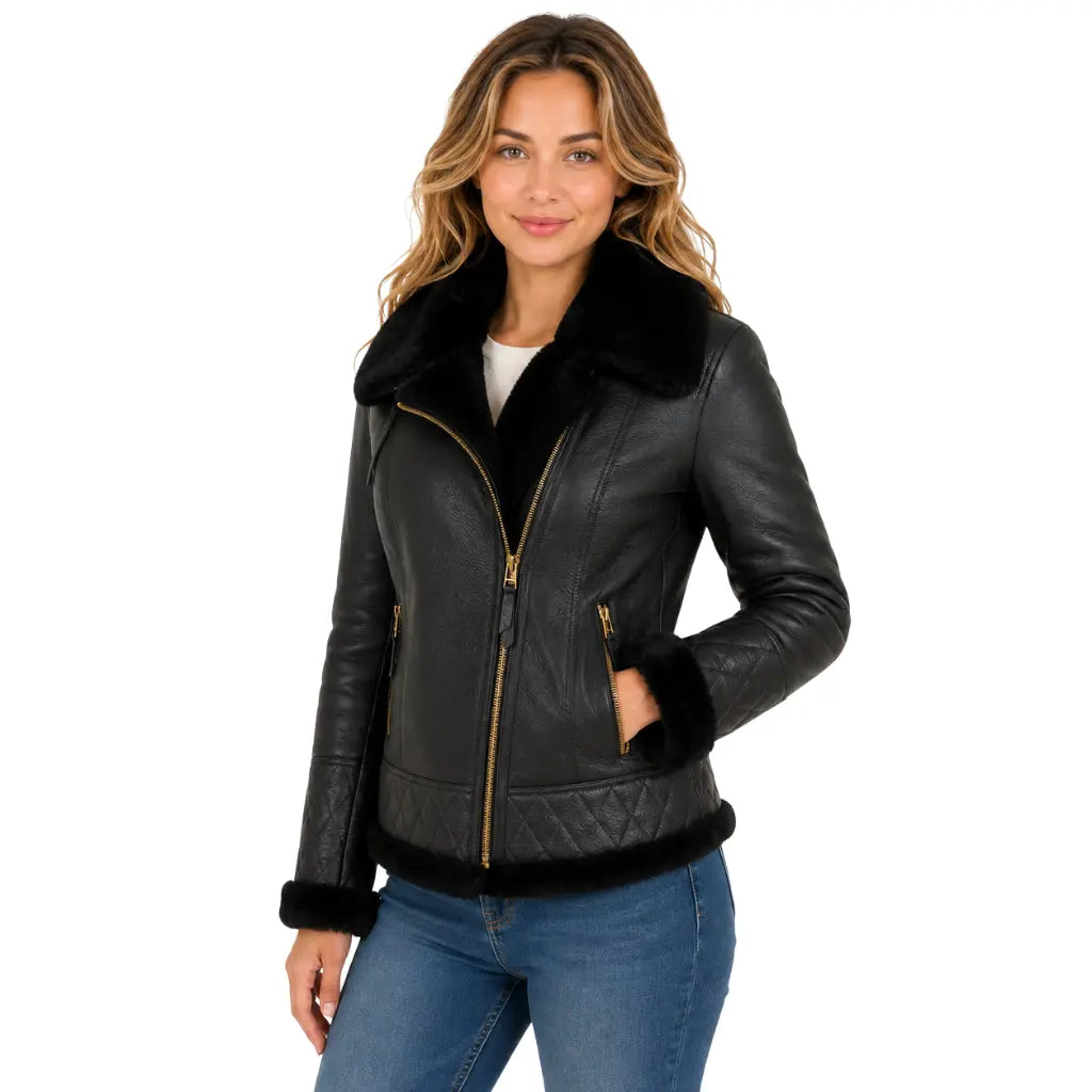 Three-quarter front view of women's black B3 sheepskin leather jacket with detachable hood featuring premium leather, plush shearling collar and gold hardware.