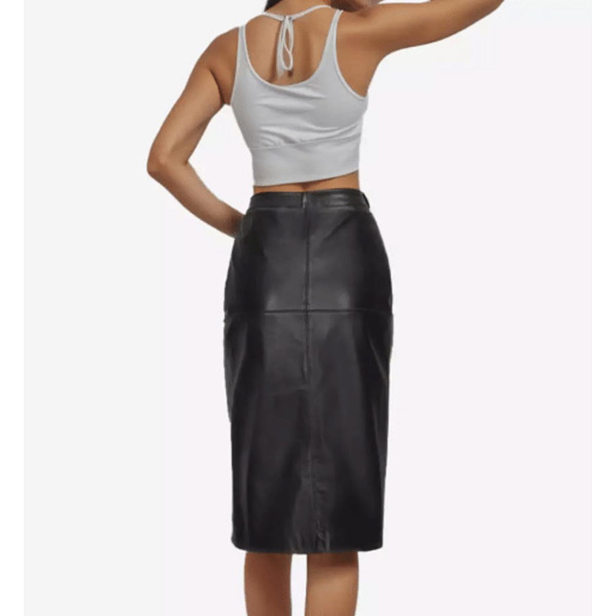 Back view of a tailored women's black leather knee-length pencil skirt highlighting the smooth rear paneling and vertical center stitching