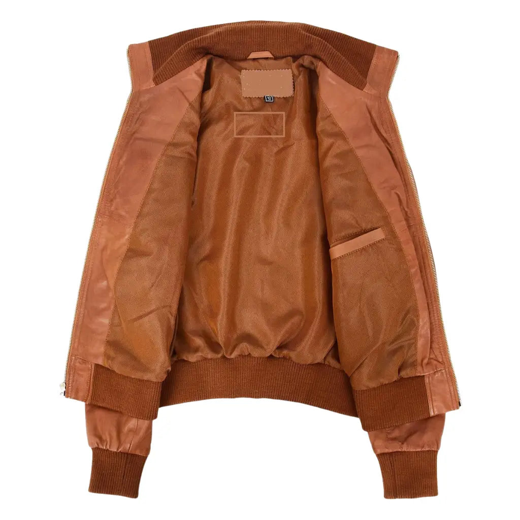 Interior view of Women's Classic Tan Genuine Leather Bomber Jacket featuring a soft polyester lining and inner storage pocket.