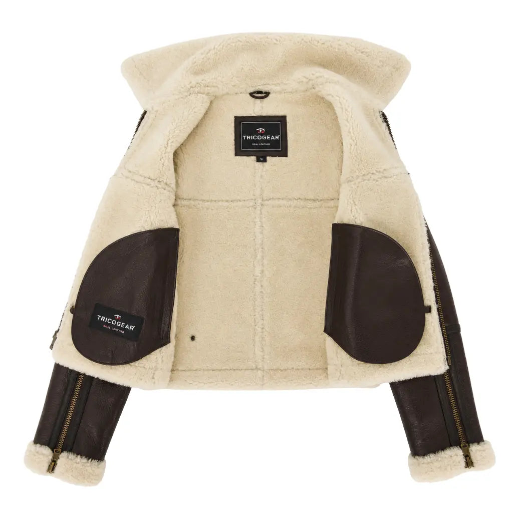 Interior view of the women's genuine sheepskin RAF aviator jacket displaying the full white shearling lining, leather pocket trim, and TricoGear branded label.