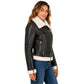 Side profile of the women's brown and white sheepskin RAF aviator jacket highlighting the zip cuff, fitted silhouette, waist belt, and luxurious shearling lining.
