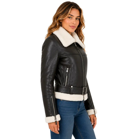 Side profile of the women's brown and white sheepskin RAF aviator jacket highlighting the zip cuff, fitted silhouette, waist belt, and luxurious shearling lining.